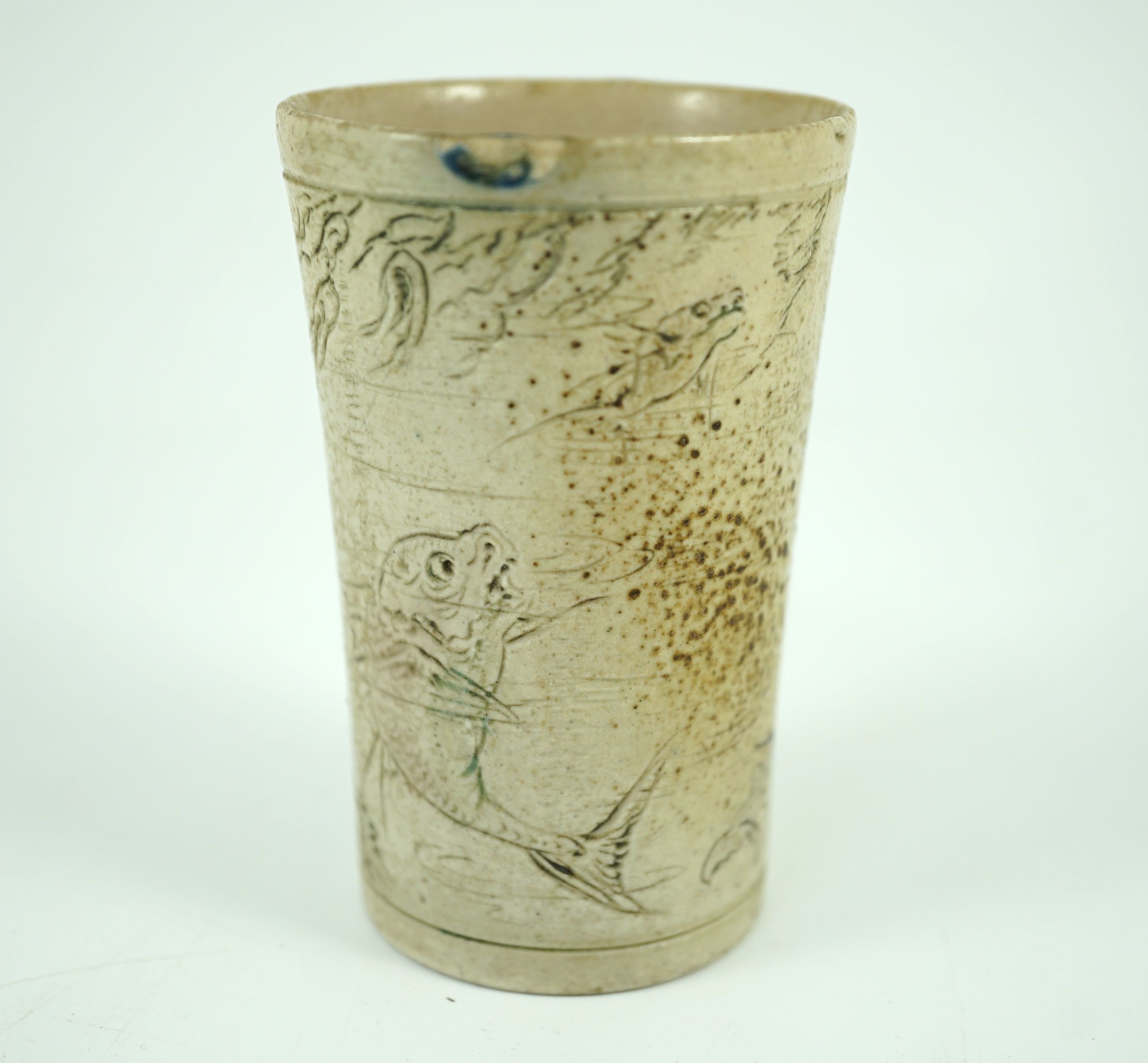 A Martin Brothers ‘grotesque fish’ beaker, dated 1914, 8.7cm high, hairline crack